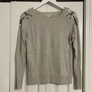 Greyish tan sweater with bejeweled shoulder